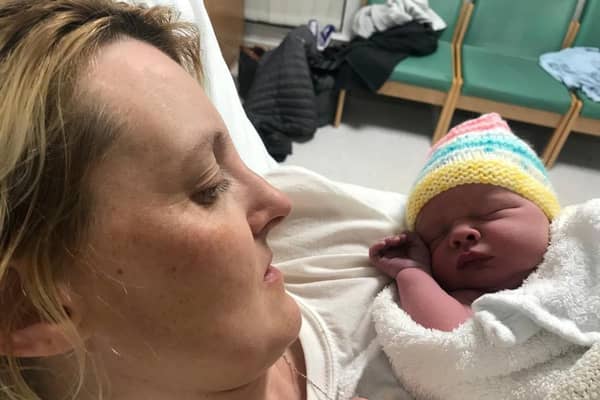 Jayne Leck, 36, went into labour with baby Aria Grace - and her partner Francie Quinn, 46, helped to deliver the tot in the back of a cab. (SWNS)