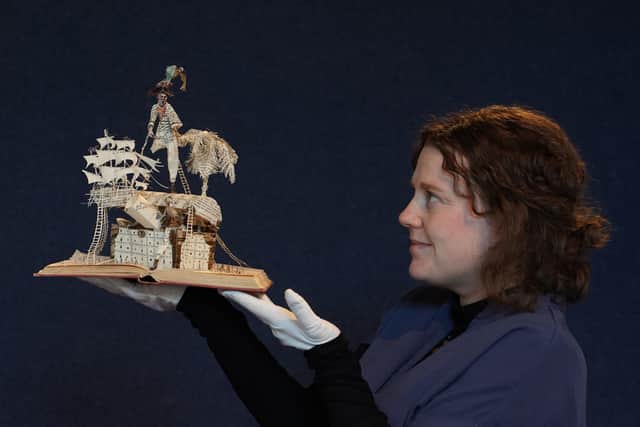 Catherine Marsden of Lyon and Turnbull with the Treasure Island sculpture
