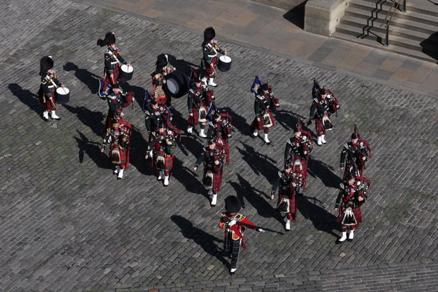 Members of a band march outside St Giles' Cathedral, Edinburgh, ahead of a Service of Prayer and Reflection for the Life of Queen Elizabeth II.