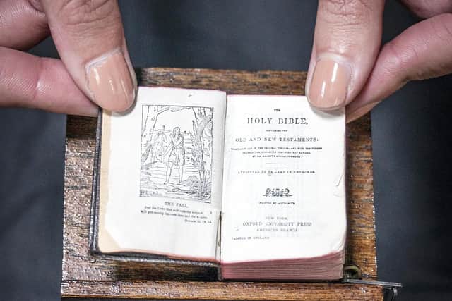 The tiny bible even has its very own special miniature lectern