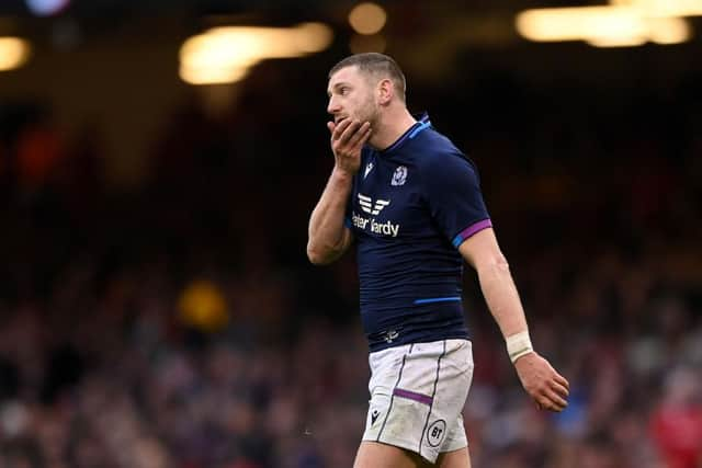 Finn Russell of Scotland leaves the field after he receives a yellow card for a knock on during the Guinness Six Nations match between Wales and Scotland at Principality Stadium on February 12, 2022 in Cardiff, Wales. (Photo by Stu Forster/Getty Images)