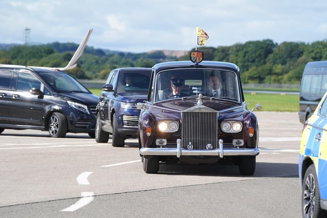 The motorcade carrying King Charles III and the Queen Consort leaves Edinburgh Airport after Charles and Camilla travelled from London, ahead of joining the procession of Queen Elizabeth's coffin from the Palace of Holyroodhouse to St Giles' Cathedral, Edinburgh. Picture date: Monday September 12, 2022.