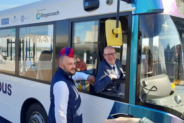 Stagecoach autonomous bus safety driver Stuart Doidge, left, with transport minister Kevin Stewart at the wheel. Picture: The Scotsman