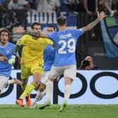 Lazio's Italian goalkeeper Ivan Provedel celebrates after scoring in the last minute against Atetico Madrid.