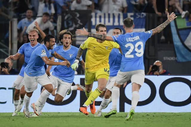 Lazio's Italian goalkeeper Ivan Provedel celebrates after scoring in the last minute against Atetico Madrid.