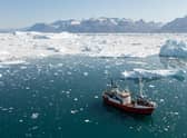 Researchers monitoring water temperatures in Sermilik Fjord, southeast Greenland.