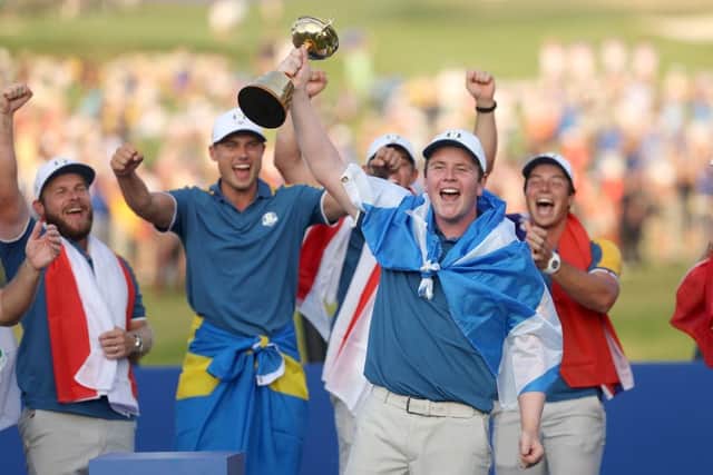 Bob MacIntyre lifts the Ryder Cup after being unbeaten on his debut for Europe at Marco Simone Golf Club in Rome. Picture: Patrick Smith/Getty Images.
