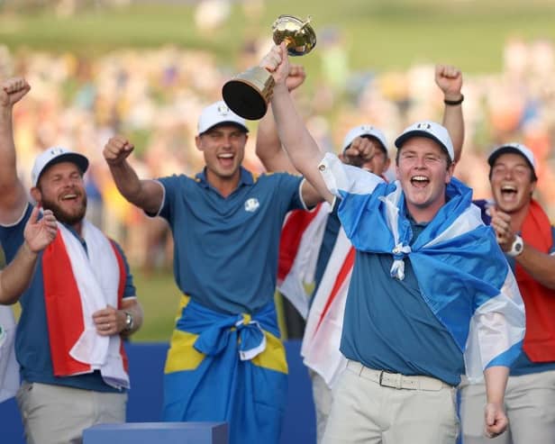 Bob MacIntyre lifts the Ryder Cup after being unbeaten on his debut for Europe at Marco Simone Golf Club in Rome. Picture: Patrick Smith/Getty Images.