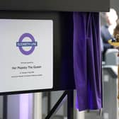 Queen Elizabeth II unveils a plaque to mark the Elizabeth line's official opening at Paddington station in London, to mark the completion of London's Crossrail project. Picture date: Tuesday May 17, 2022.