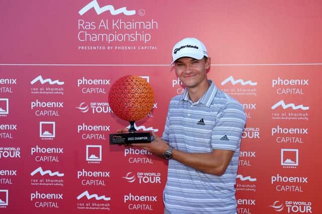 Nicolai Hojgaard shows off the trophy after winning the Ras al Khaimah Championship presented by Phoenix Capital at Al Hamra Golf Club. Picture: Andrew Redington/Getty Images.