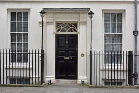 The front door of 11 Downing Street,  the official residence of the Chancellor of the Exchequer.