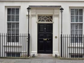 The front door of 11 Downing Street,  the official residence of the Chancellor of the Exchequer.