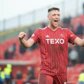 Mattie Pollock celebrates after helping Aberdeen defeat Hearts 3-0. (Photo by Paul Byars / SNS Group)