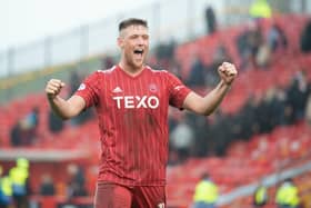 Mattie Pollock celebrates after helping Aberdeen defeat Hearts 3-0. (Photo by Paul Byars / SNS Group)