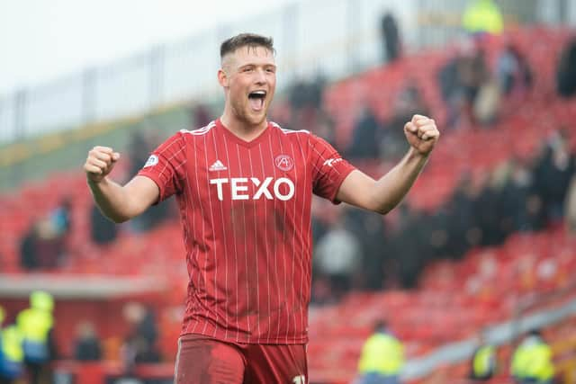 Mattie Pollock celebrates after helping Aberdeen defeat Hearts 3-0. (Photo by Paul Byars / SNS Group)