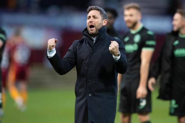 Hibs manager Lee Johnson celebrates at full time after the 3-2 win against Motherwell.