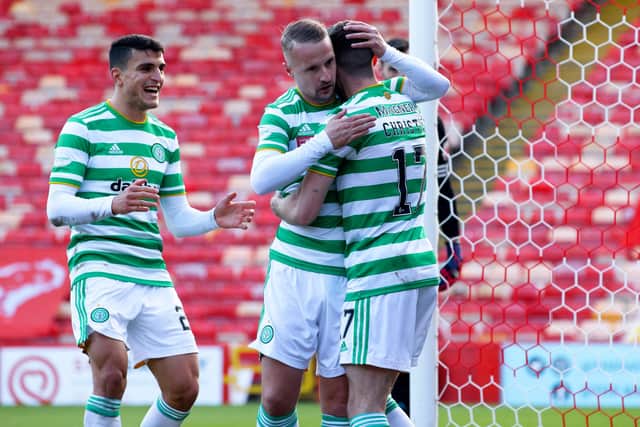 Leigh Griffiths celebrates with Ryan Christie after the latter puts Celtic 3-2 up. Picture: SNS