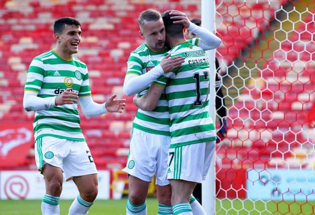 Leigh Griffiths celebrates with Ryan Christie after the latter puts Celtic 3-2 up. Picture: SNS
