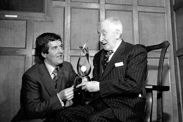 Harry Bannerman is presented with The Frank MoranTrophy by Frank Moran, seated, in January 1973. Picture: Denis Straughan