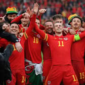 Gareth Bale of Wales celebrates with teammates after their victory over Ukraine.