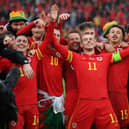 Gareth Bale of Wales celebrates with teammates after their victory over Ukraine.