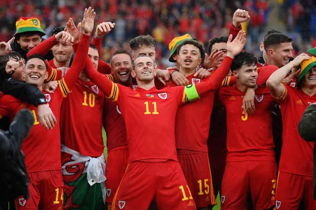 Gareth Bale of Wales celebrates with teammates after their victory over Ukraine.