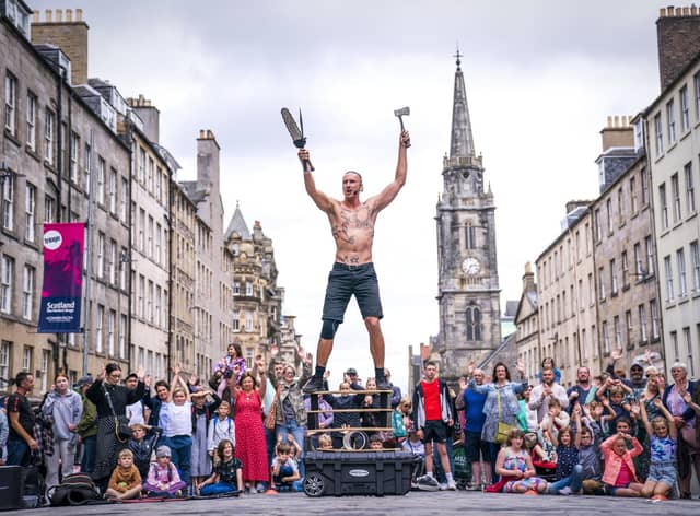 Circus street artist 'Reidiculous' performs for the Fringe crowds on the Royal Mile. Picture: Jane Barlow/PA Wire
