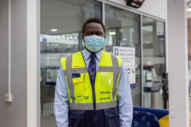 A ScotRail staff member demonstrates how to properly wear a face mask. Pic: ScotRail/Twitter