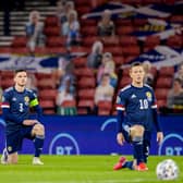 GLASGOW, SCOTLAND - OCTOBER 08: Scotland's Andy Robertson and Callum McGregor take the knee in support of the Black Lives Matter movement during a Euro 2020 Play off match between Scotland and Israel at Hampden Park, on October 08 2020, in Glasgow, Scotland (Photo by Craig Williamson / SNS Group)
