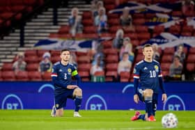 GLASGOW, SCOTLAND - OCTOBER 08: Scotland's Andy Robertson and Callum McGregor take the knee in support of the Black Lives Matter movement during a Euro 2020 Play off match between Scotland and Israel at Hampden Park, on October 08 2020, in Glasgow, Scotland (Photo by Craig Williamson / SNS Group)