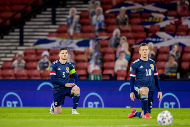 GLASGOW, SCOTLAND - OCTOBER 08: Scotland's Andy Robertson and Callum McGregor take the knee in support of the Black Lives Matter movement during a Euro 2020 Play off match between Scotland and Israel at Hampden Park, on October 08 2020, in Glasgow, Scotland (Photo by Craig Williamson / SNS Group)