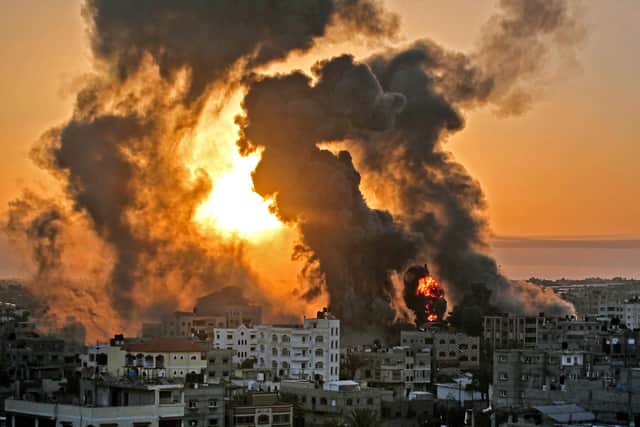 A fire rages in Khan Yunish in the Gaza Strip, following an Israeli airstrike (Picture: Youssef Massoud/AFP via Getty Images)