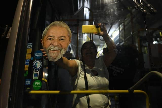 A supporter of Luiz Inacio Lula da Silva celebrates after her candidate won the presidential runoff election in Sao Paulo, Brazil.