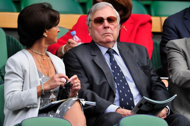 Peter Alliss sits in the royal box on Centre Court at Wimbledon with his wife Jackie in 2013. Picture: Glyn Kirl/AFP.