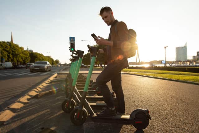 A tourist using public scooters. Pic: Alamy/PA.