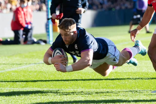 Scotland's Kyle Steyn dives over for his second try. (Photo by Ross Parker / SNS Group)
