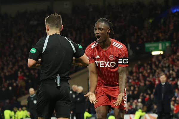 Aberdeen captain Anthony Stewart tries to plead his innocence after his red card.