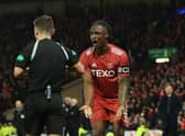 Aberdeen captain Anthony Stewart tries to plead his innocence after his red card.