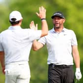 Michael Block is congratulated by playing partner Rory McIlroy after making a hole-in-one during the final round of the PGA Championship at Oak Hill Country Club in May. Picture: Andrew Redington/Getty Images.