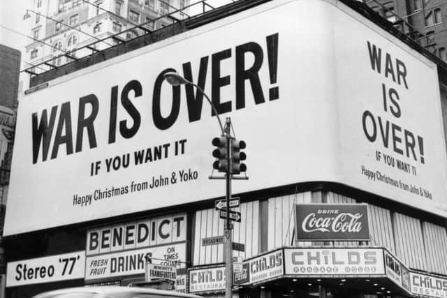A large Christmas peace message reading 'War Is Over!' from John Lennon and Yoko Ono displayed on a billboard in New York in 1971. The message, protesting against US involvement in the Vietnam War, was simultaneously displayed in Montreal, Toronto, Los Angeles and six European cities (Picture: Three Lions/Getty Images)
