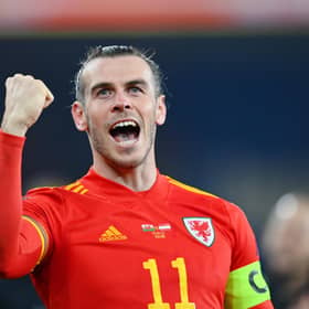 Gareth Bale celebrates after leading Wales to a 2-1 victory in the World Cup play-off semi-final against Austria. (Photo by Dan Mullan/Getty Images)