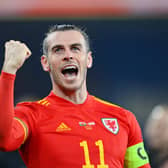 Gareth Bale celebrates after leading Wales to a 2-1 victory in the World Cup play-off semi-final against Austria. (Photo by Dan Mullan/Getty Images)