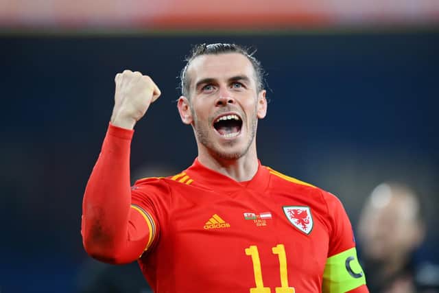 Gareth Bale celebrates after leading Wales to a 2-1 victory in the World Cup play-off semi-final against Austria. (Photo by Dan Mullan/Getty Images)