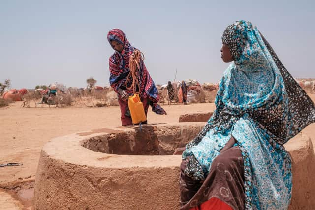 Women stand next to a water well in the camp for internally displaced people of Farburo 2 in the village of Adlale, near the city of Gode, Ethiopia. The worst drought to hit the Horn of Africa for 40 years is pushing 20 million people towards starvation, according to the UN, destroying an age-old way of life and leaving many children suffering from severe malnutrition as it rips families apart (Photo: Eduardo Soteras/AFP via Getty Images)