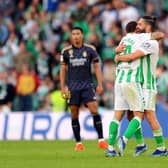 Aitor Ruibal of Real Betis (obscured) celebrates scoring their team's first goal with team mate Isco against Real Madrid.