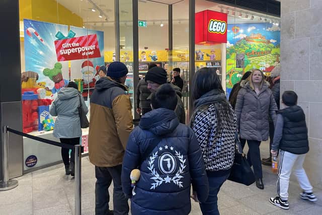 People were forced to queue to get inside some popular shops in the St James Quarter, including the Lego store