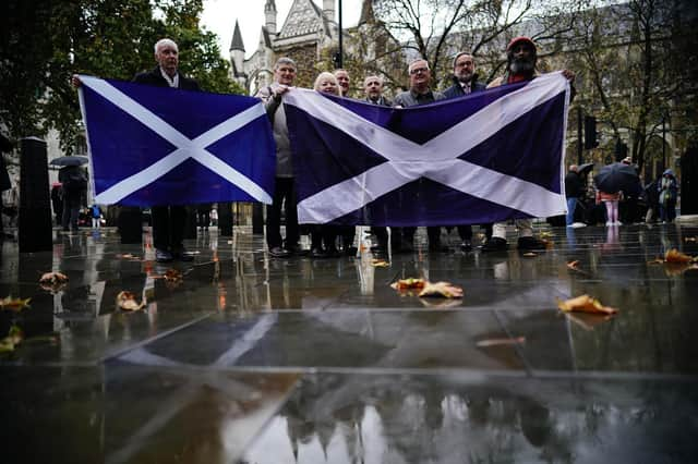 People outside the UK Supreme Court in London, while they waited for the decision by Supreme Court judges to grant or refuse the Scottish Parliament power to hold a referendum on independence. Picture: Aaron Chown/PA Wire