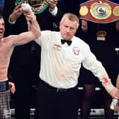Josh Taylor (L) is declared the victor over Jack Catterall during the WBA, WBC, WBO & IBF world super-lightweight title fight at the OVO Hydro.