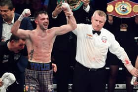 Josh Taylor (L) is declared the victor over Jack Catterall during the WBA, WBC, WBO & IBF world super-lightweight title fight at the OVO Hydro.