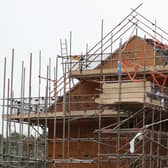 Houses under construction on a housing development. PIC: Andrew Matthews/PA Wire
